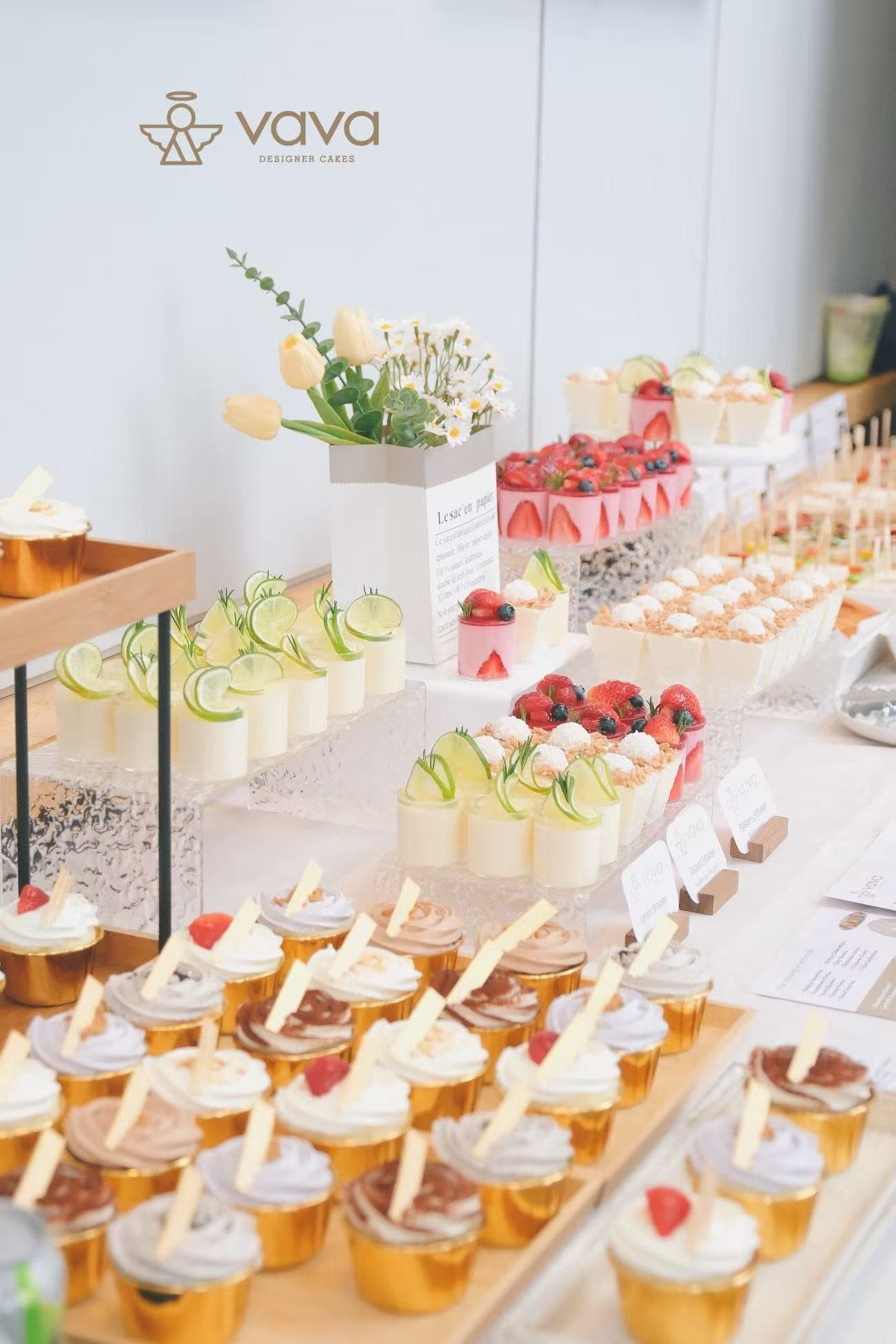 Full sweet table spread of mousse cups, cupcakes and canapés by Vava, Toronto dessert caterer