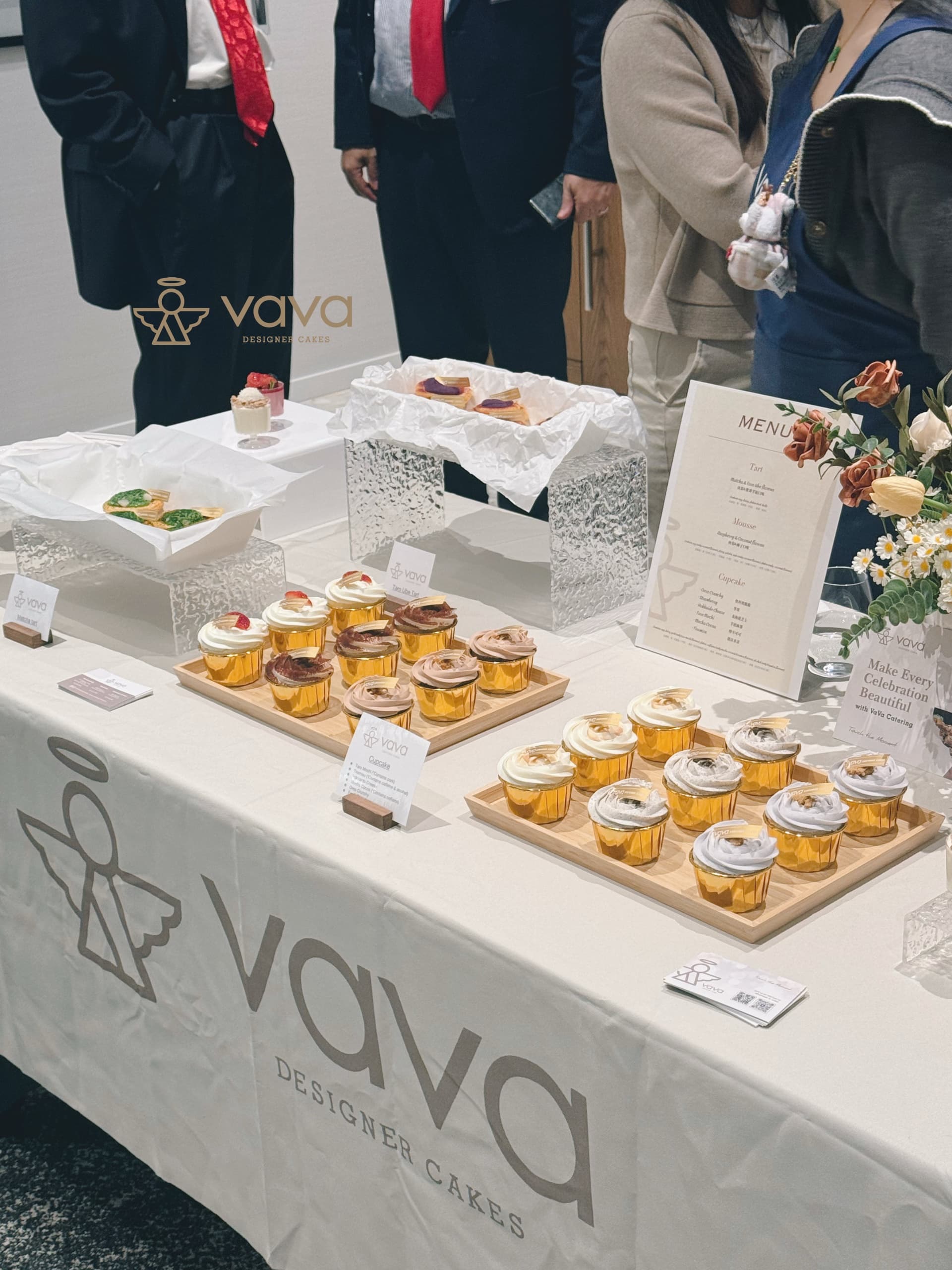 Vava dessert table with cupcakes, tarts and menu signage at a Toronto reception