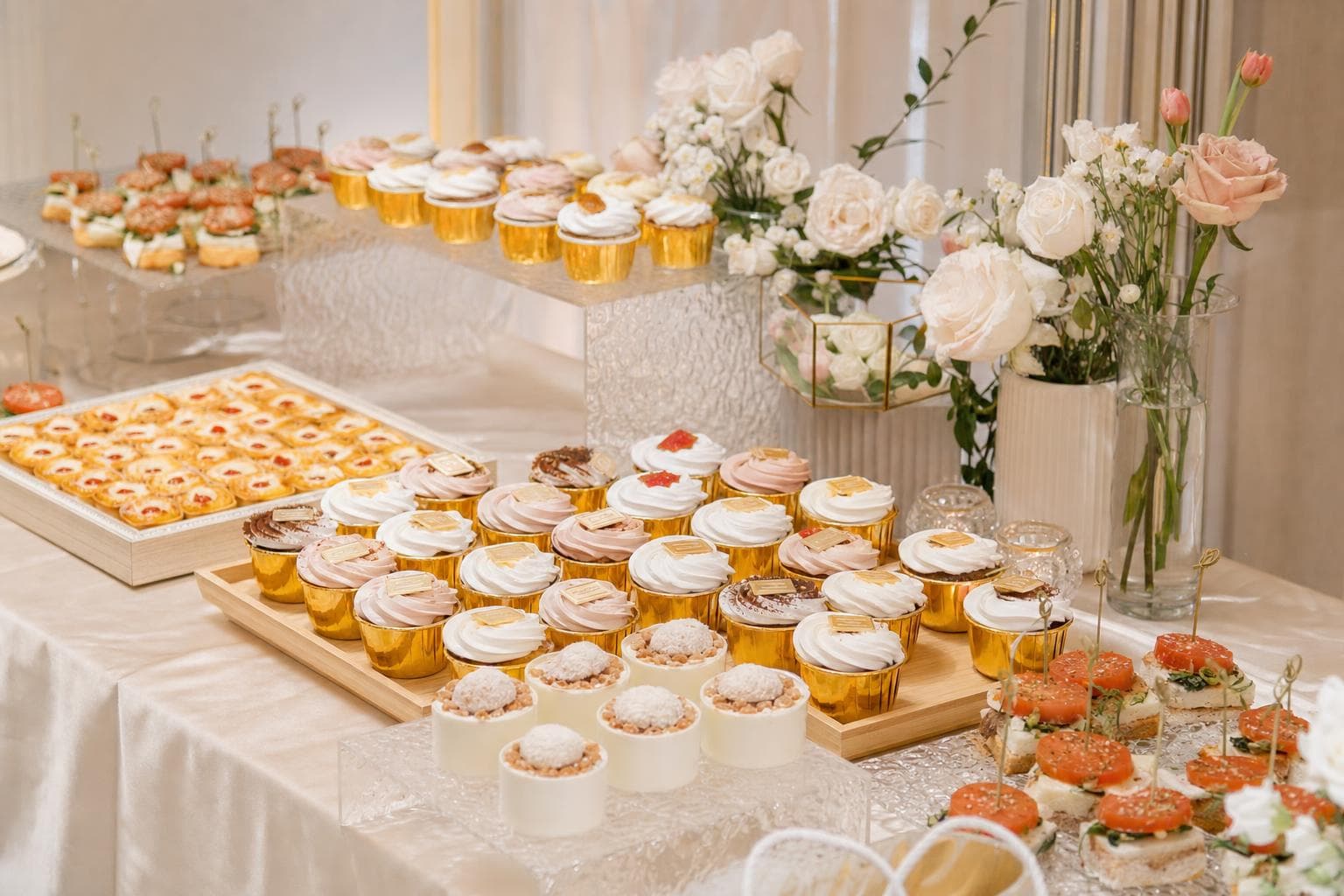Wedding dessert table styled to match a blush and ivory palette